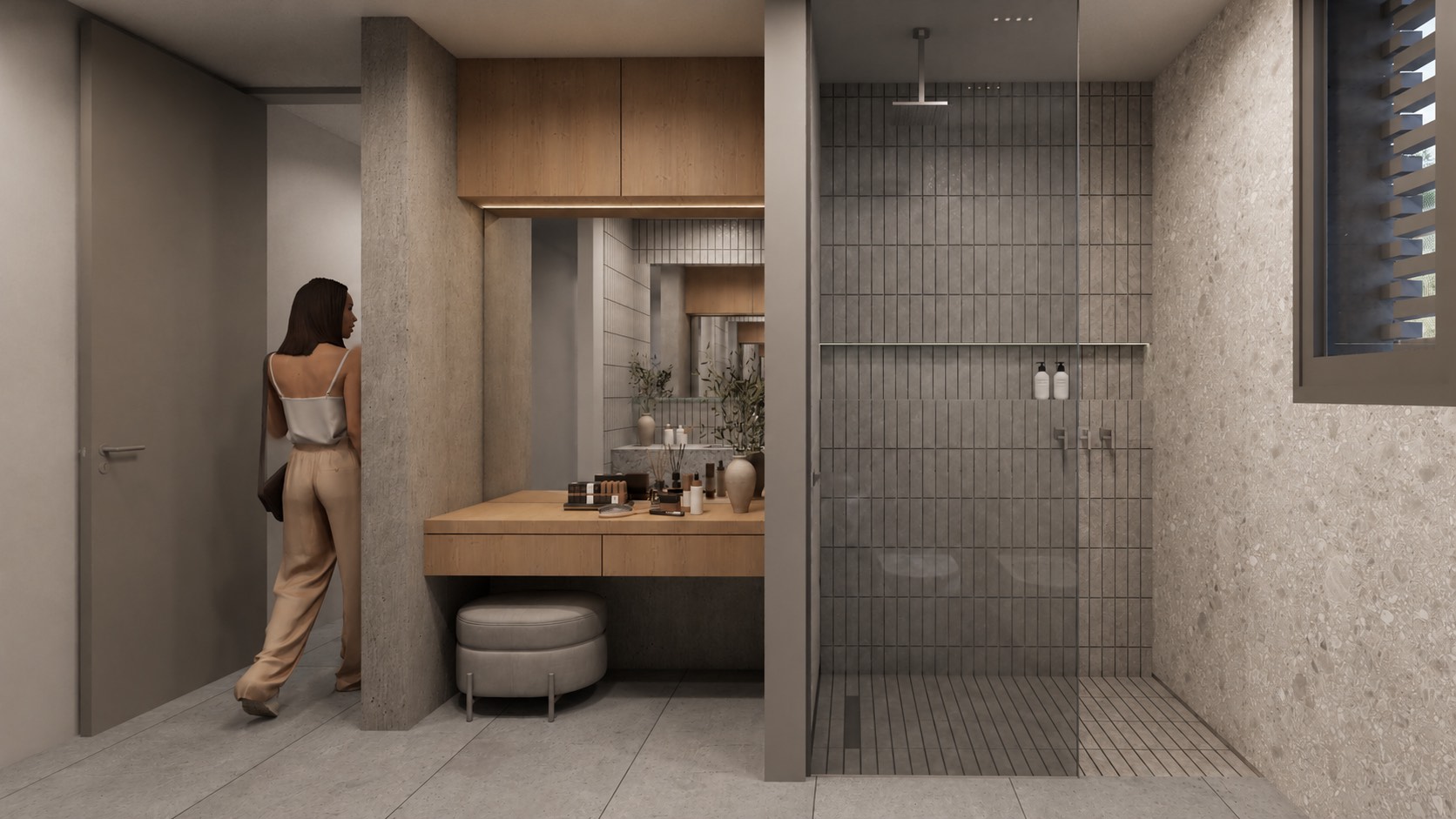 El baño principal desde la puerta: la ducha con mampara de vidrio, el tocador de madera con espejo y la banqueta.